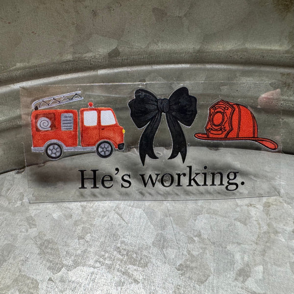 He’s Working Sticker Decal